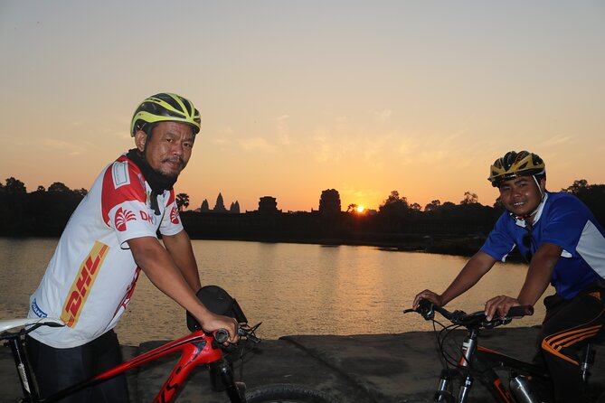 Angkor Sunrise Expedition Cycling Through Serene Backroads - Angkor Thom walls: the moat-and-jungle feeling on two wheels