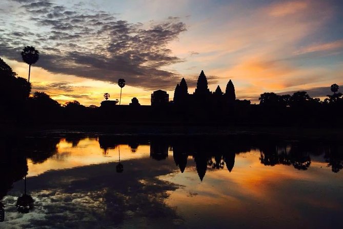 One Day tour with sunrise in car with A/C or Van & Guide. - Angkor Thom and Bayon’s smiling faces