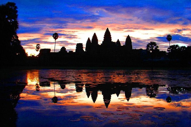 One Day tour with sunrise in car with A/C or Van & Guide. - South Gate and Baphuon: where the city feels real