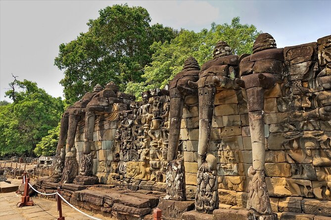 Siem Reap: Angkor Wat Sunrise Bike Tour & Jungle Breakfast - Bayon: the faces in the stone and the story behind them